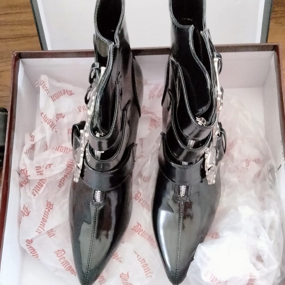 Demonia 6 medium black, silver with skulls heeled boots. Never wore in box still